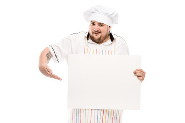 portrait of chef pointing at blank banner in hand isolated on white