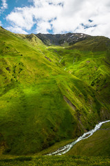 Green caucassian valley, mountains, river looks like Alps