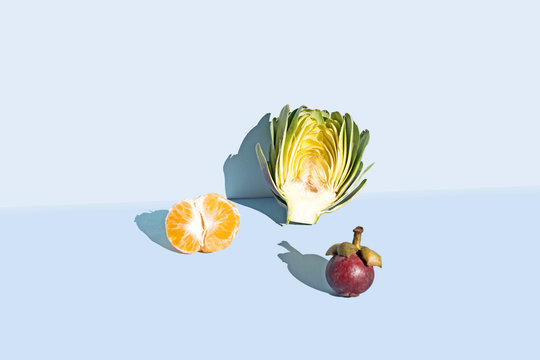 Organic fruit against blue background, studio shot 
