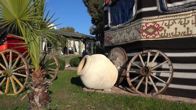 Ethnical stuff exhibition on open air - Byzantine tent, vase and carriage with wooden wheels