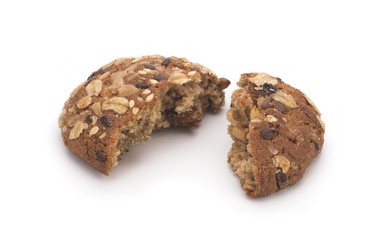 Broken oatmeal cookies on a white background