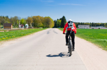 Obraz premium cyclist riding a bicycle. Cycling, active rest, healthy lifestyle