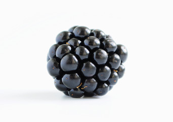 Ripe blackberry isolated on white background.