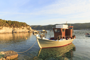 Traditional Greek fishing boats in the natural bay, Colorful boats in Aegean sea, Photo of beautiful blue sea with floating boats and nature