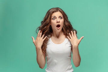 Fototapeta premium Portrait of young woman with shocked facial expression