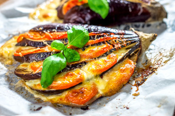 Fototapeta na wymiar Italian traditional dish with eggplant, tomato and mozzarella