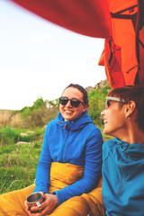 Fototapeta premium two girls having fun near the tent camping..
