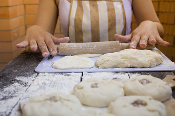 the girl prepares a pie with meat and onions