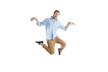 Fototapeta na wymiar young casual man jumping with funny expression isolated on white