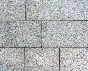 Area laid out of paving stone. Background texture relief.