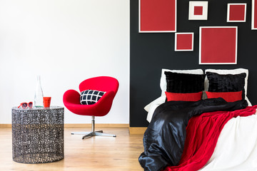 Black wall in a bedroom
