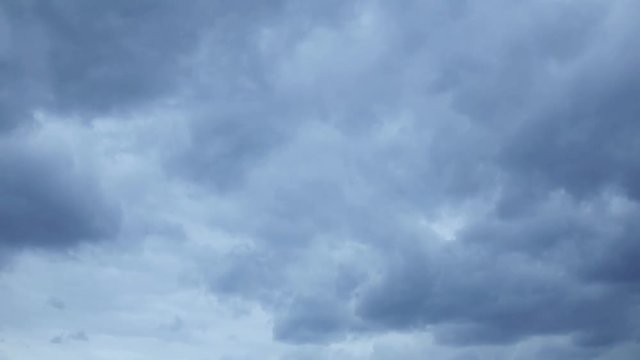 Time lapse of heavy rain cloud approach on stormy sky