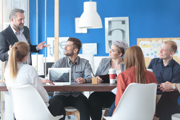 Employees listening to their manager