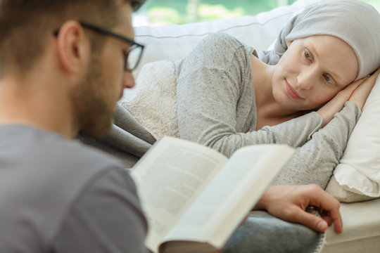 Husband reading to his wife