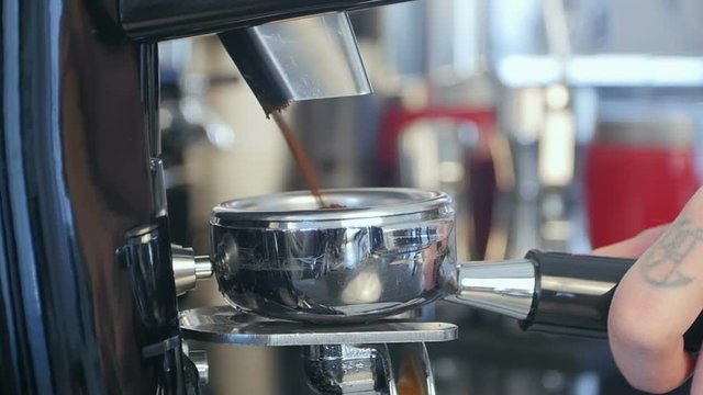 Barista take coffee grind in group