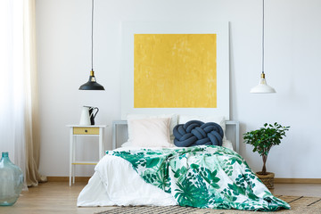 Yellow painting in bedroom