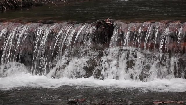 Beautiful rapids on mountains river and small waterfall. Slow motion