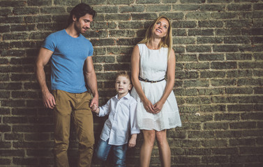 Obraz na płótnie Canvas Family home portrait. Parents and son spending time together