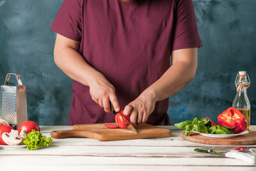 Closeup hand of chef baker making pizza at kitchen