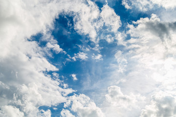 white clouds in the blue sky.