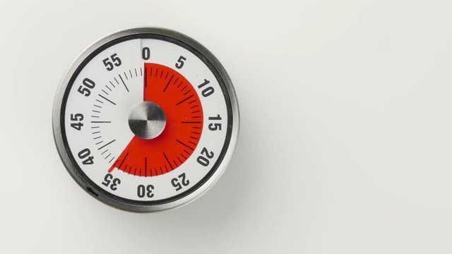 Vintage analog kitchen countdown timer, 45 minutes in 20 seconds time lapse shot