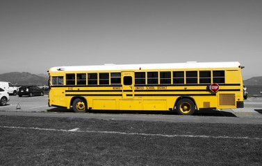 Fototapeta na wymiar SAN FRANCISCO - 15 APRIL, 2017: Yellow school bus of Novato Unified School District, California, 2017.