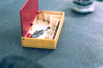 Fishing tackle on black background with blurred background.