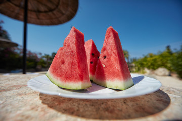 Watermelon, cut slices on a plate.