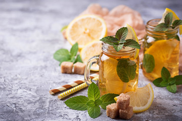 Iced tea with lemon and mint.