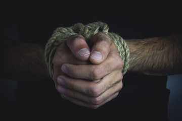a young man tied hands