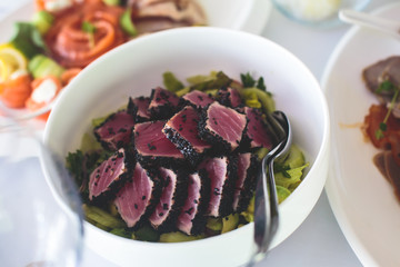 Decorated catering banquet table with different food appetizers assortment on a party
