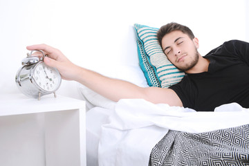 Man with alarm clock.