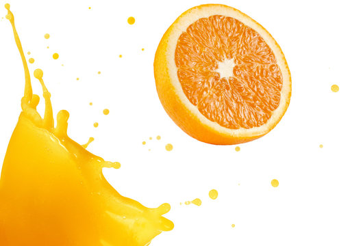 orange splashing out of fresh juice
