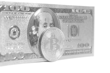 Silver bitcoin with silver U.S. dollar isolated on white