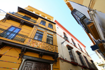 Fototapeta na wymiar Old street and buildings in Seville.