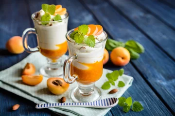 Foto auf Acrylglas Dessert Layered apricot and cream cheese dessert