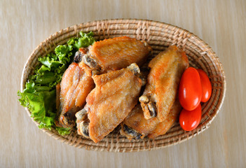 Fried wing chicken on wooden background