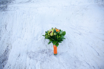 Selective focus shot of beautiful wedding bouquet on the background of the sea