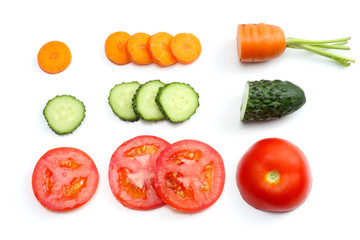 sliced tomatoes, sliced carrot, sliced cucumber, parsley and fresh green peas isolated on a white background. top view