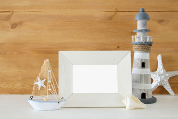 Obraz premium Nautical concept with sea life style objects on wooden table. For photography montage