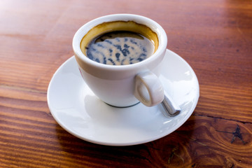 wonderful white cup of hot coffee on table