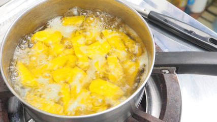 To boiling pumpkin of Thai dessert in pot