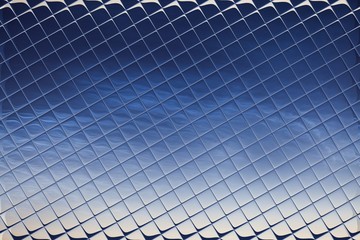 Abstract background, blue cloudy sky through the glass