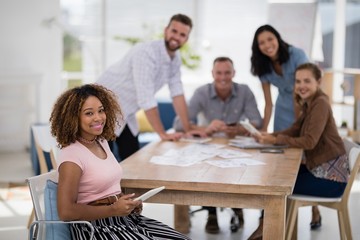 Female executive using digital tablet in the office