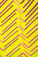 Abstrat background formed with multiple straws over a yellow flashy background, studio shot,  Texture theme.