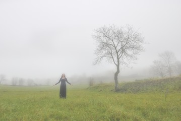 woman dancing in the rain, fog