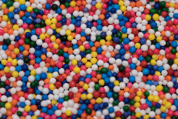 Fototapeta na wymiar Macro pattern colorful sugar for texture and background. Colorful sprinkles sugar made for topping bakery