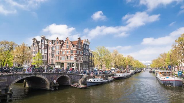 Amsterdam city skyline timelapse at canal waterfront, Amsterdam, Netherlands, 4K Time Lapse