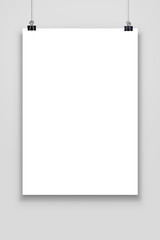 Blank paper poster mockup isolated on a gray background.
