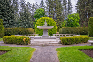 Beautiful fountain in the middle of the park. Amazing park landscape. Manito Park and Botanical Gardens, Spokane, Washington, United States